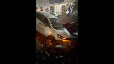 Owner steps away for shopping, parked car rolls into open drain in Noida