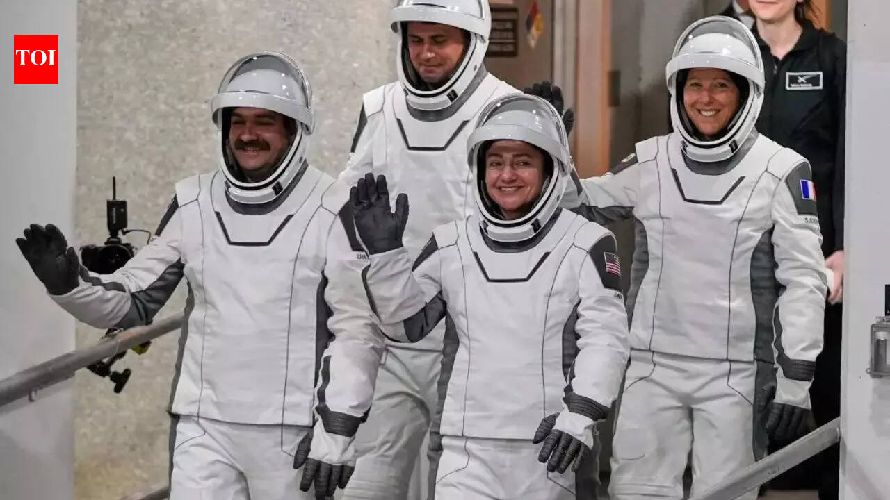 Four astronauts arrive at International Space Station via SpaceX to bring crew back to full strength