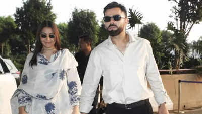 Virat Kohli and Anushka Sharma TWIN in white as they jet out of Mumbai city - PICS
