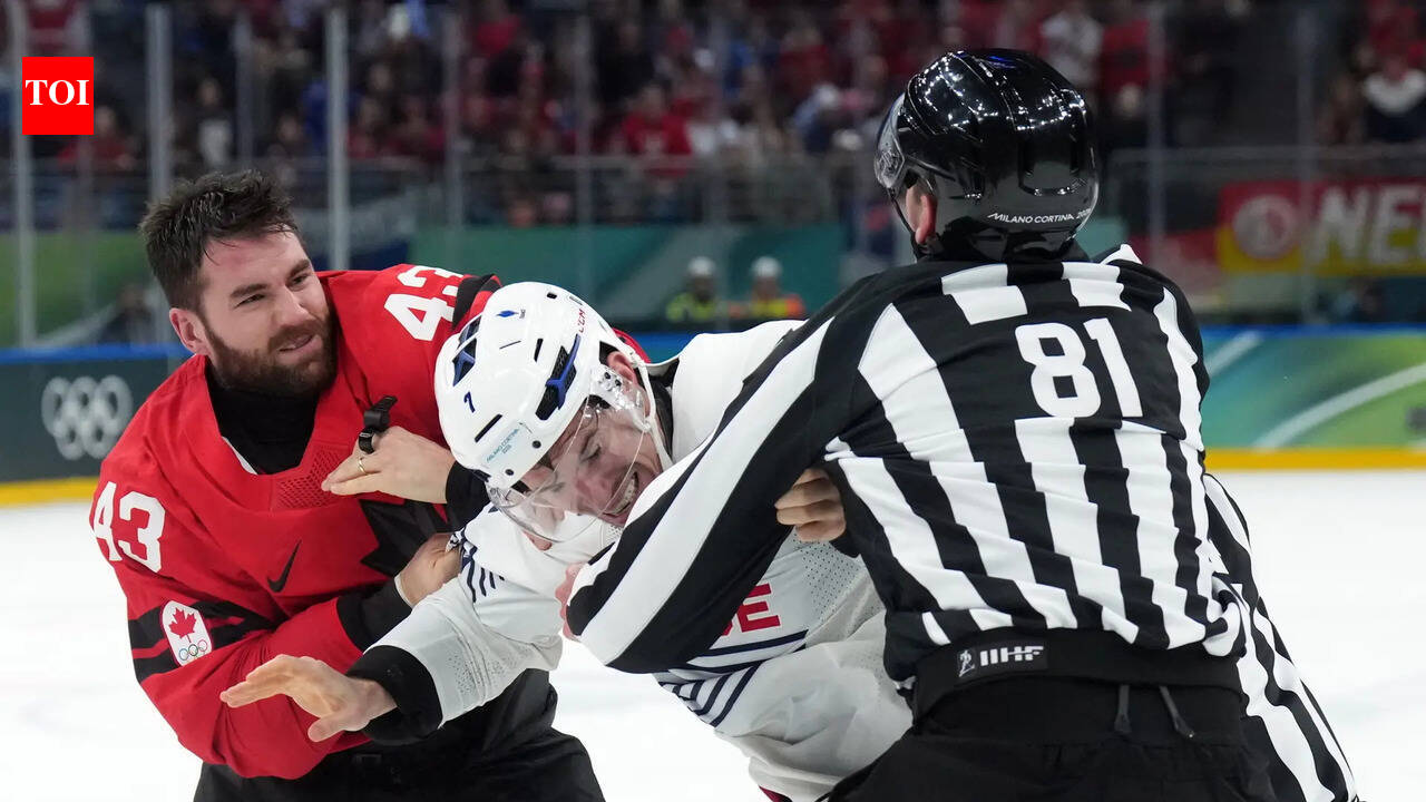 Nathan MacKinnon reacts after Tom Wilson fight during Team Canada and Team France Olympic ice hockey game