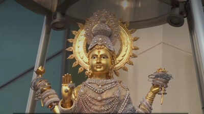  Devotees show photos and offer pink treats for love