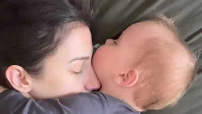 Baby cuddles mom in sleep; viral reel celebrates motherhood, self-worth and quiet strength