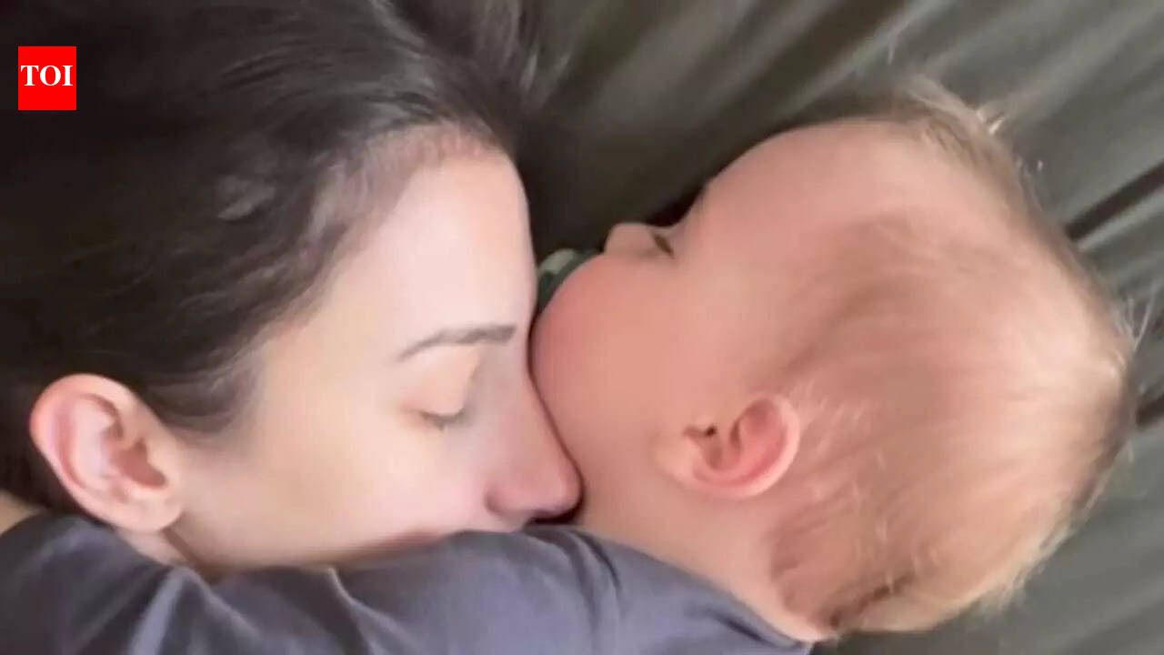 Baby cuddles mom in sleep; viral reel celebrates motherhood, self-worth and quiet strength