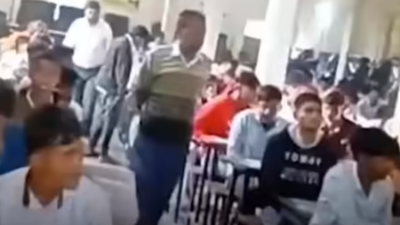 Bihar Class 10 exams marred by chaos: Viral clip shows students scaling walls, using chits & phones, live streaming on FB