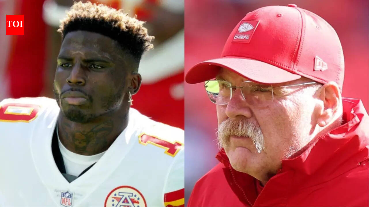 Chiefs head coach Andy Reid sends a “nothing happening” signal to Miami Dolphins WR Tyreek Hill