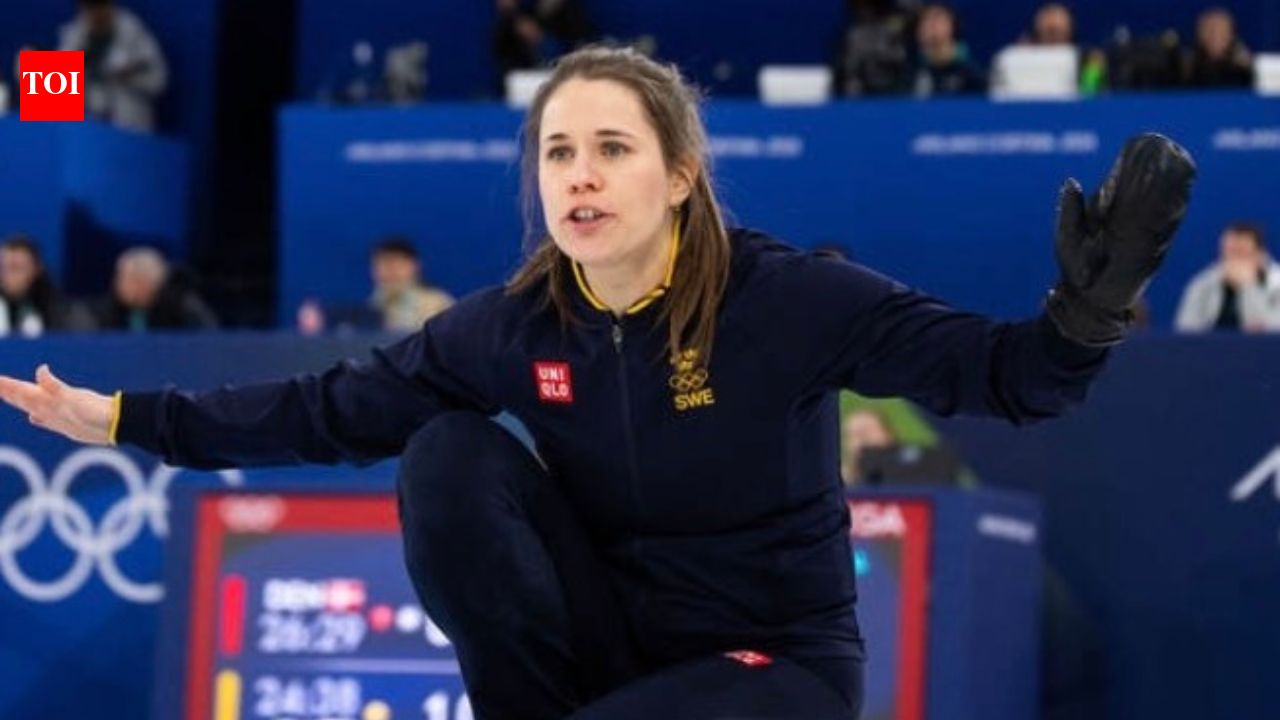 Sweden’s Anna Hasselborg’s hands over her medal to the “special ones” in her life after Winter Olympic curling gold