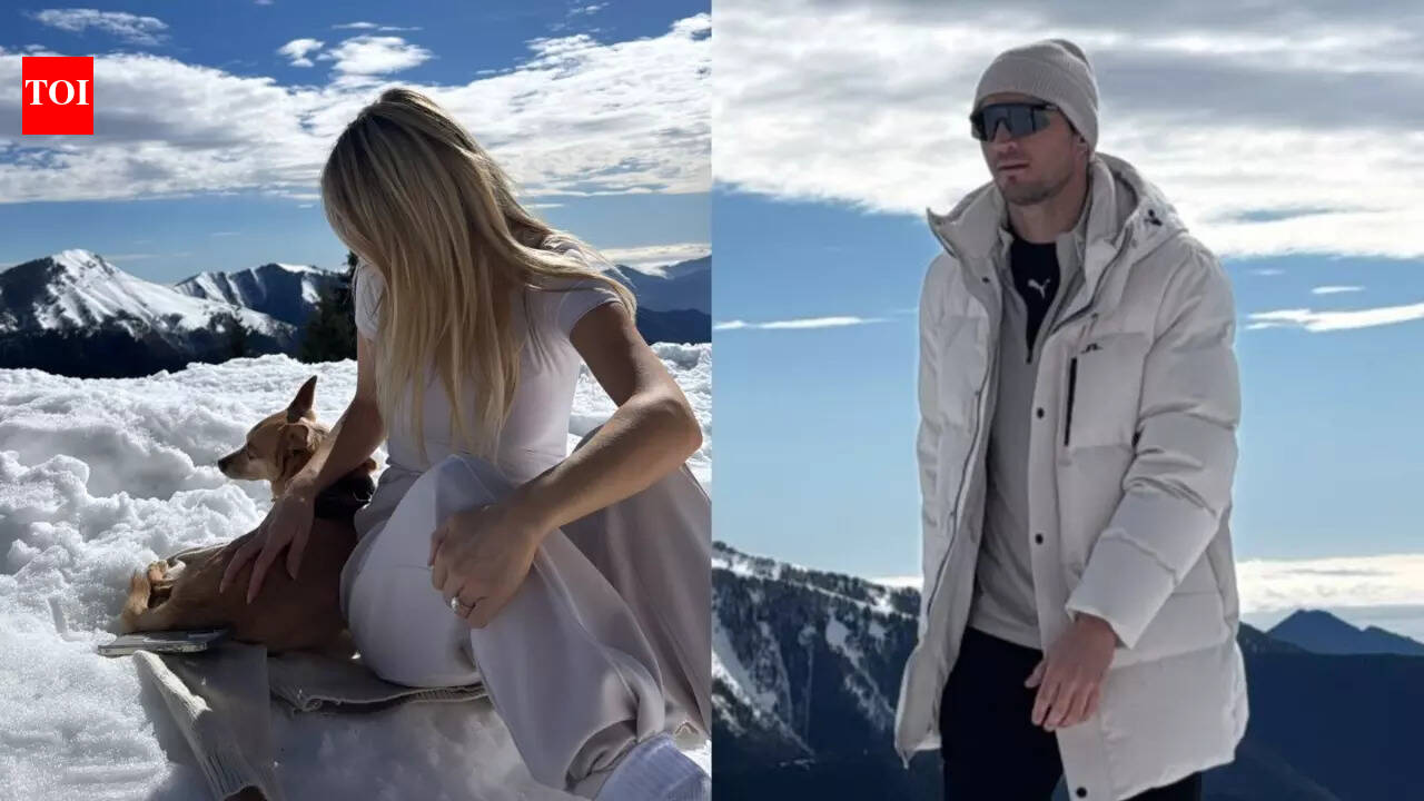 Jake Dennis and fiancee Lexi Grace Boosey twin in white as they hit the snow with pup Billy