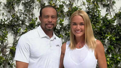 Kai Trump and mom Vanessa Trump share a moment with Tiger Woods for pictures at the golf event