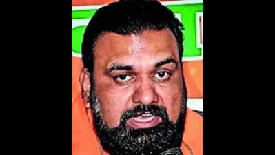 Deputy CM hands over land papers to martyr’s widow