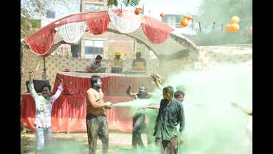 City celebrates Holi with flower petals, gulal
