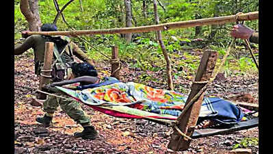 Security forces rescue woman with burns from remote village in Bastar, carry her on makeshift stretcher