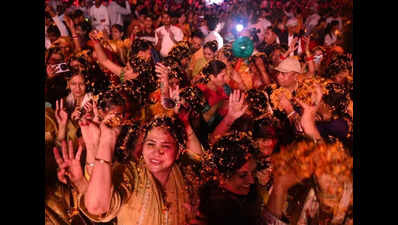 Flower shower powers Holi ritual at Iskcon temple