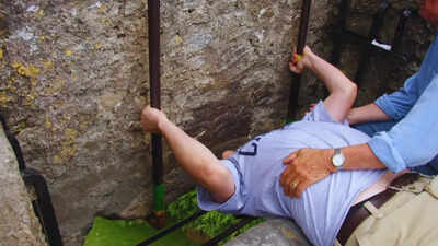 Why are thousands of visitors kissing this stone in Ireland?