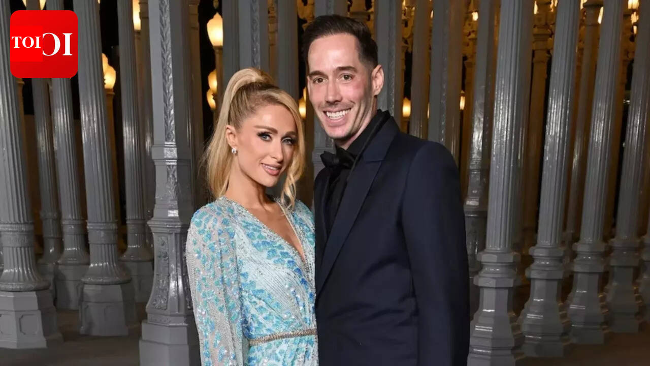Paris Hilton’s husband, Carter Reum, says ‘she loves me to death,’ squashing the ongoing rumors about their marriage