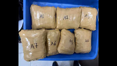2kg of cannabis left on aircraft for domestic leg; 3 held