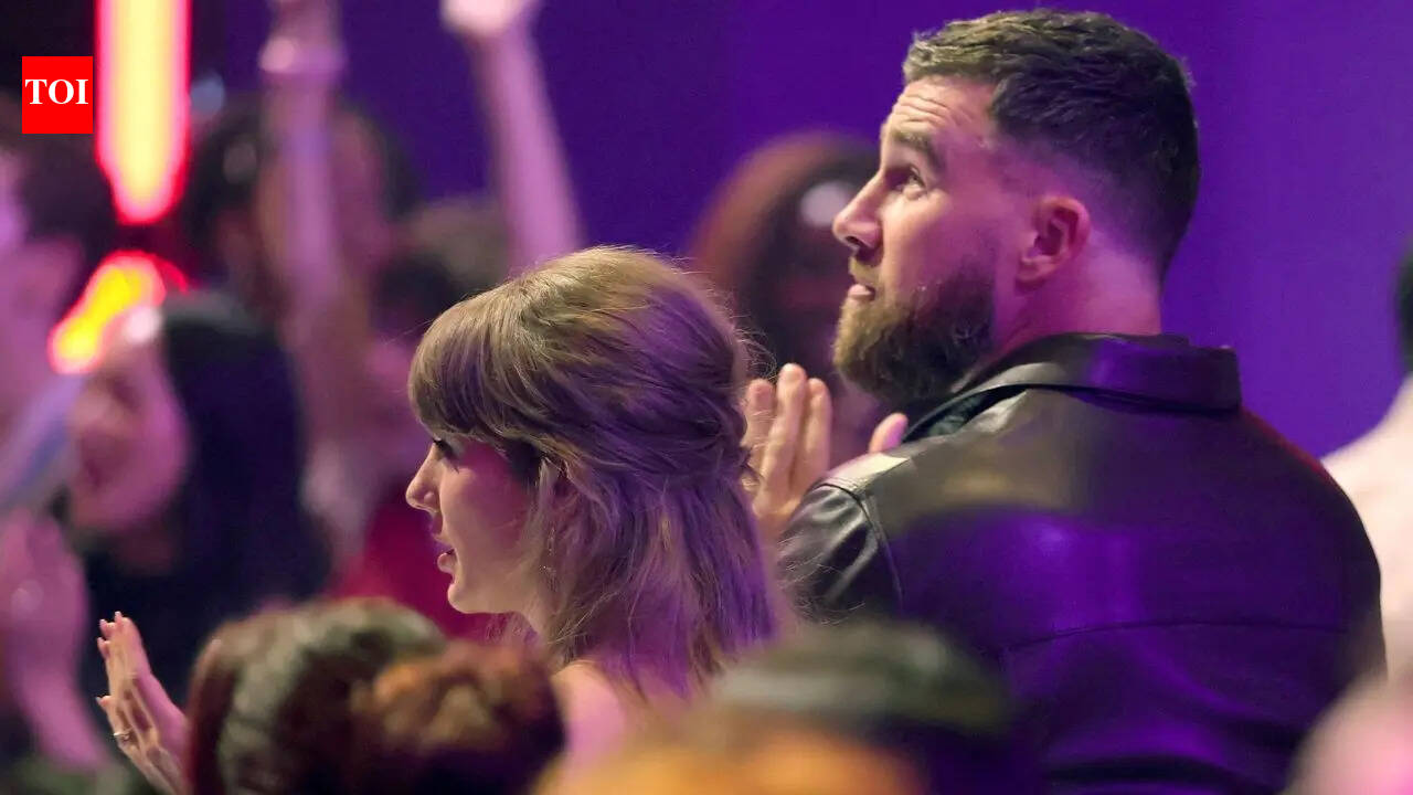 Taylor Swift stuns in mint green mini-skirt as she makes first awards show appearance with Travis Kelce