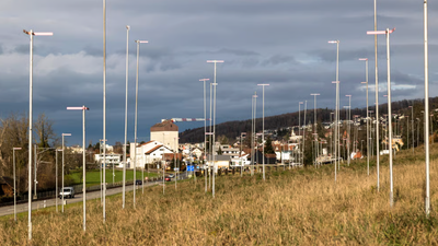 Invisible buildings: Why Switzerland marks out homes with tall poles weeks before construction