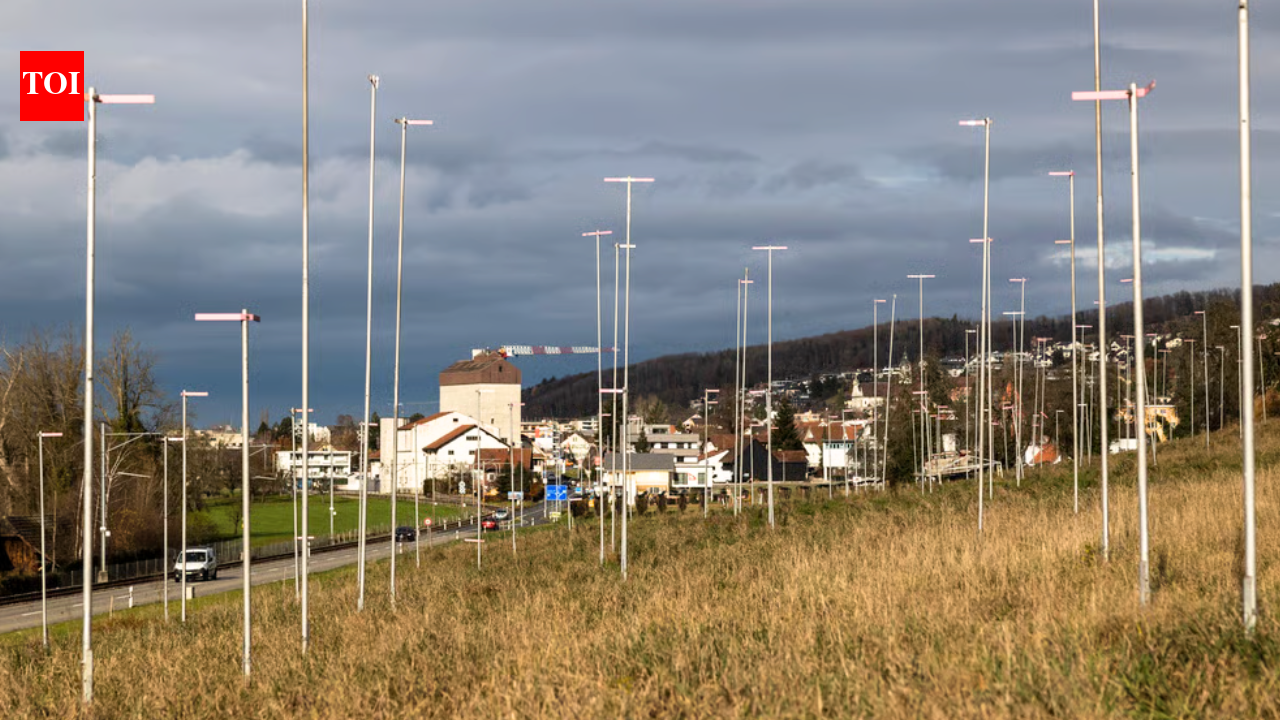 Invisible buildings: Why Switzerland marks out homes with tall poles weeks before construction