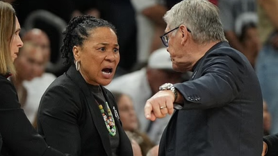 College basketball coach faces backlash after final four incident with rival coach leads to apology for heated courtside argument
