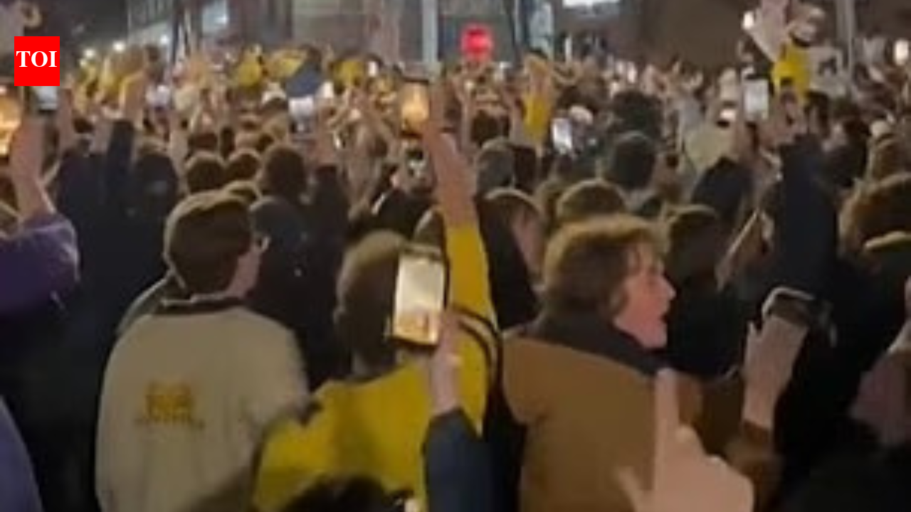 Police arrest two people after Michigan title win as fans light fires and streets in Ann Arbor turn chaotic overnight