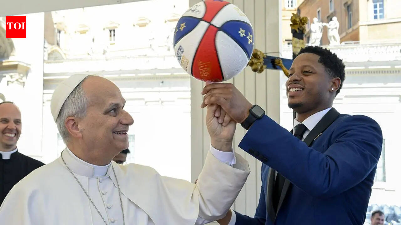 Pope Leo XIV spends quality time with Harlem Globetrotters as he attempts to spin a basketball on his finger