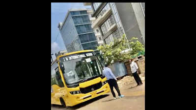 Road leading to school, condos littered with craters, flood-prone