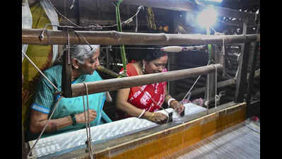 Sitharaman hands out weaver cards, TMC files MCC complaint