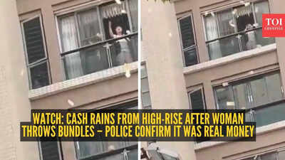 Watch: Cash rains from high-rise after woman throws bundles – police confirm it was real money