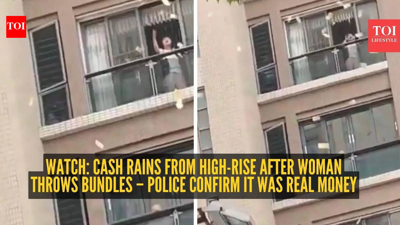 Watch: Cash rains from high-rise after woman throws bundles – police confirm it was real money