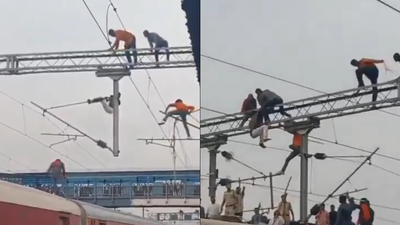 Man climbs gantry, dangles from high-tension wires at Maharashtra’s railway station; services hit for 40 minutes