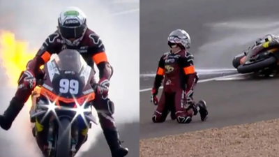 Alessandro Delbianco drops to knees in shock after motorbike catches fire during 24 Hours of Le Mans