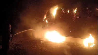 Hay touches wire, flames from tractor leap to house & shop