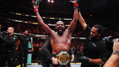Jon Jones trolls Kamaru Usman and WWE retired legend Brock Lesnar with outrageous “getting hand raised at both of you in one night” claim