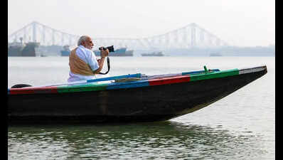 Modi visits Bengal’s ‘soul’, chats up boatmen, walkers