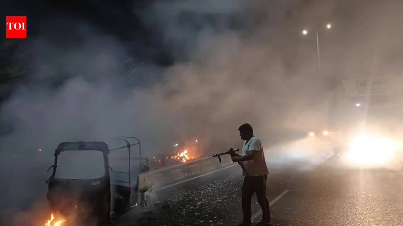 Auto goes up in flames on NH-8, driver dies