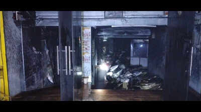 Panic in multi-storey building after EV showroom fire