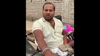 Wheelchair-bound man finds bag of cash, awaits owner