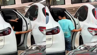 Child opens car door carefully to avoid scratches, a simple moment that reveals powerful parenting