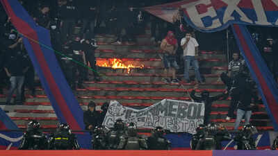 South America’s Champions League match stopped less than 2 mins in after fans started burning stadium sections