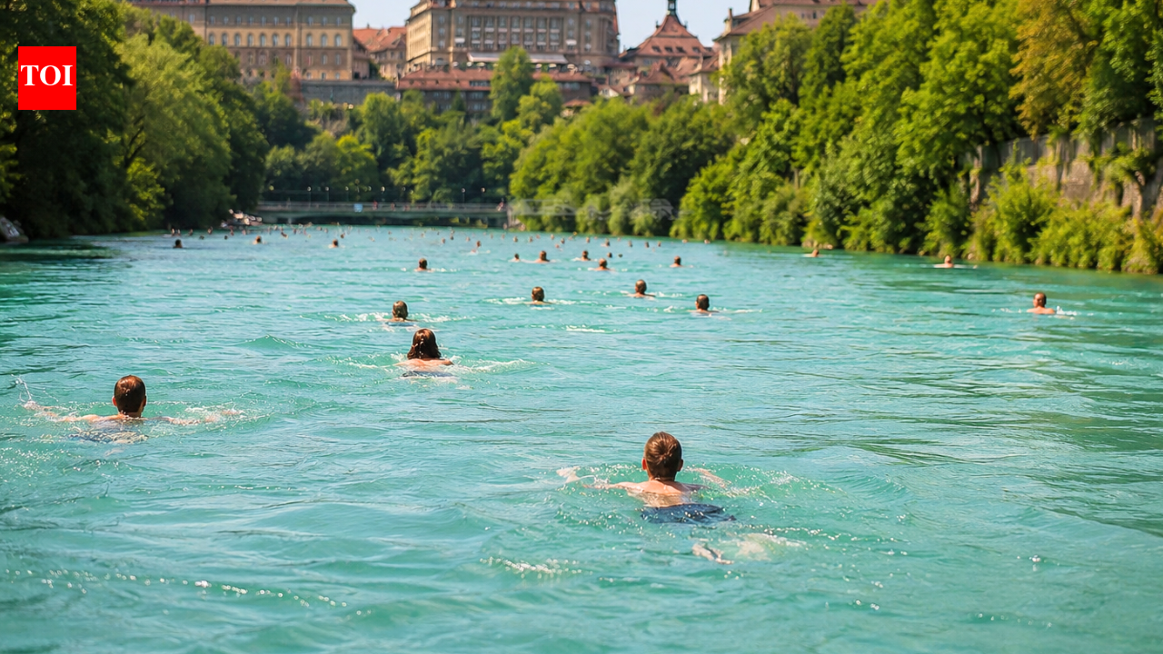 Switzerland’s summer hack: People swim through a river to get home from work