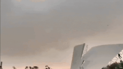 Watch: Man trying to hold tin shed gets swept into air during violent UP storm, survives terrifying fall