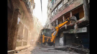 After fire-hit Tiljala building, payloader moves to adjacent residential structure