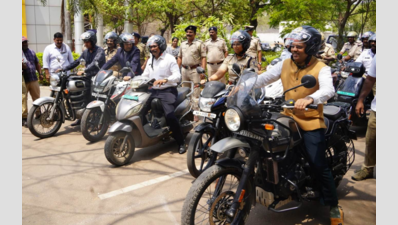 Ballari DC rides bike to promote helmet awareness