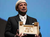 John Travolta wins honorary Palme d'Or win - WATCH