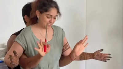 Aamir Khan's daughter Ira Khan is helped by husband Nupur Shikhare cut 29th birthday cake to save her beautiful mehendi - Watch