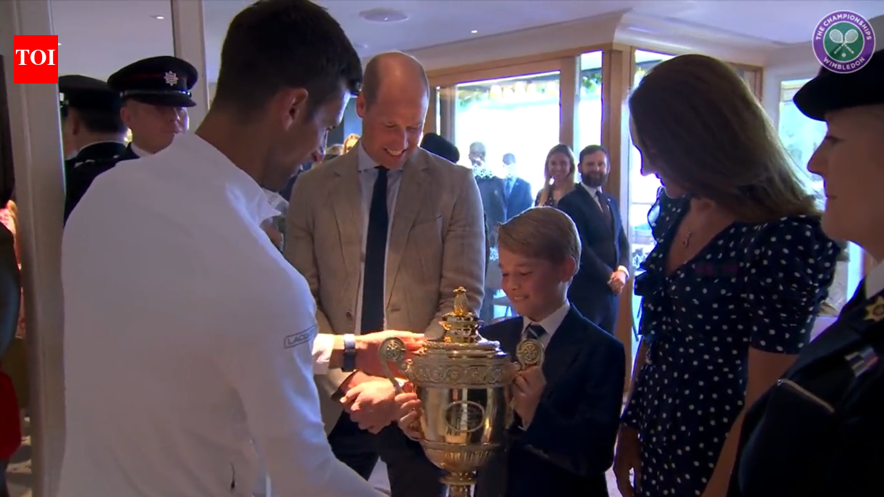 ‘Don't drop it,’ said Prince William as Novak Djokovic handed the 2022 Wimbledon trophy to Prince George