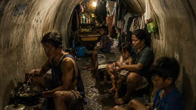 Shocking reality of 100 families living beneath Manila highways in the Philippines