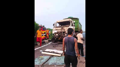 Trailer driver stuck in cabin after hitting truck, dies