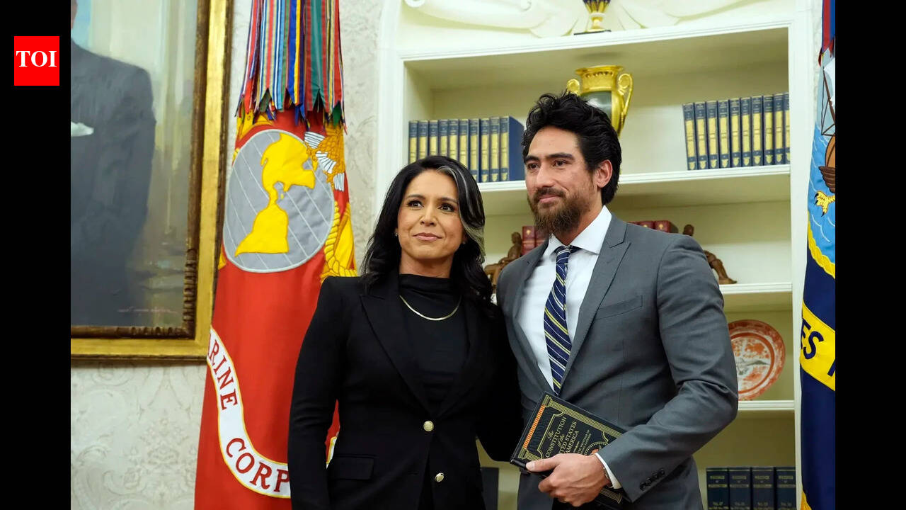 Who is Tulsi Gabbard's husband whose bone cancer cited as reason for resignation amid Iran war row?