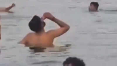 'Ab nahi piyenge': Man drinks beer while bathing in Ganga, booked after video goes viral; watch